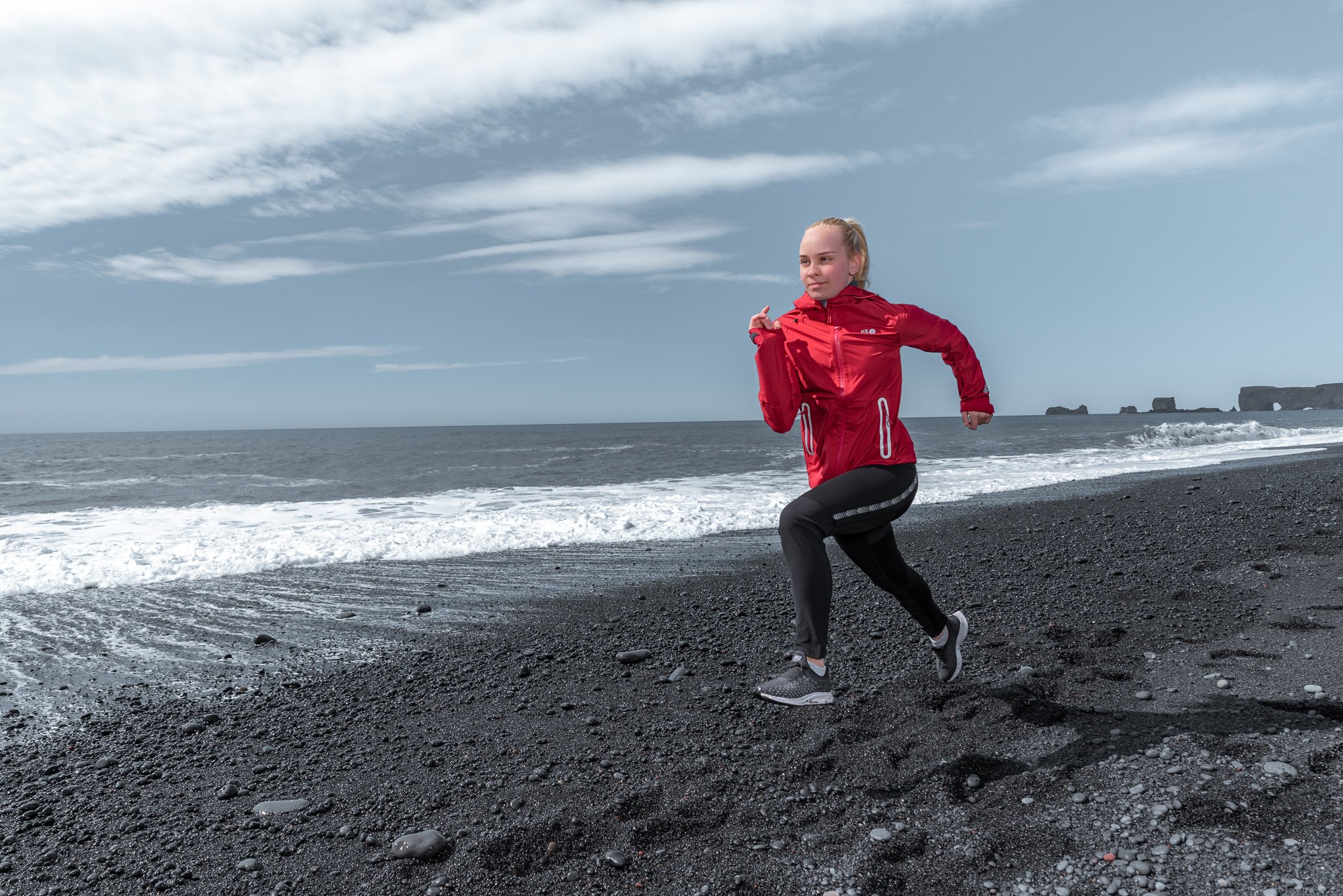 girl running on lava beach