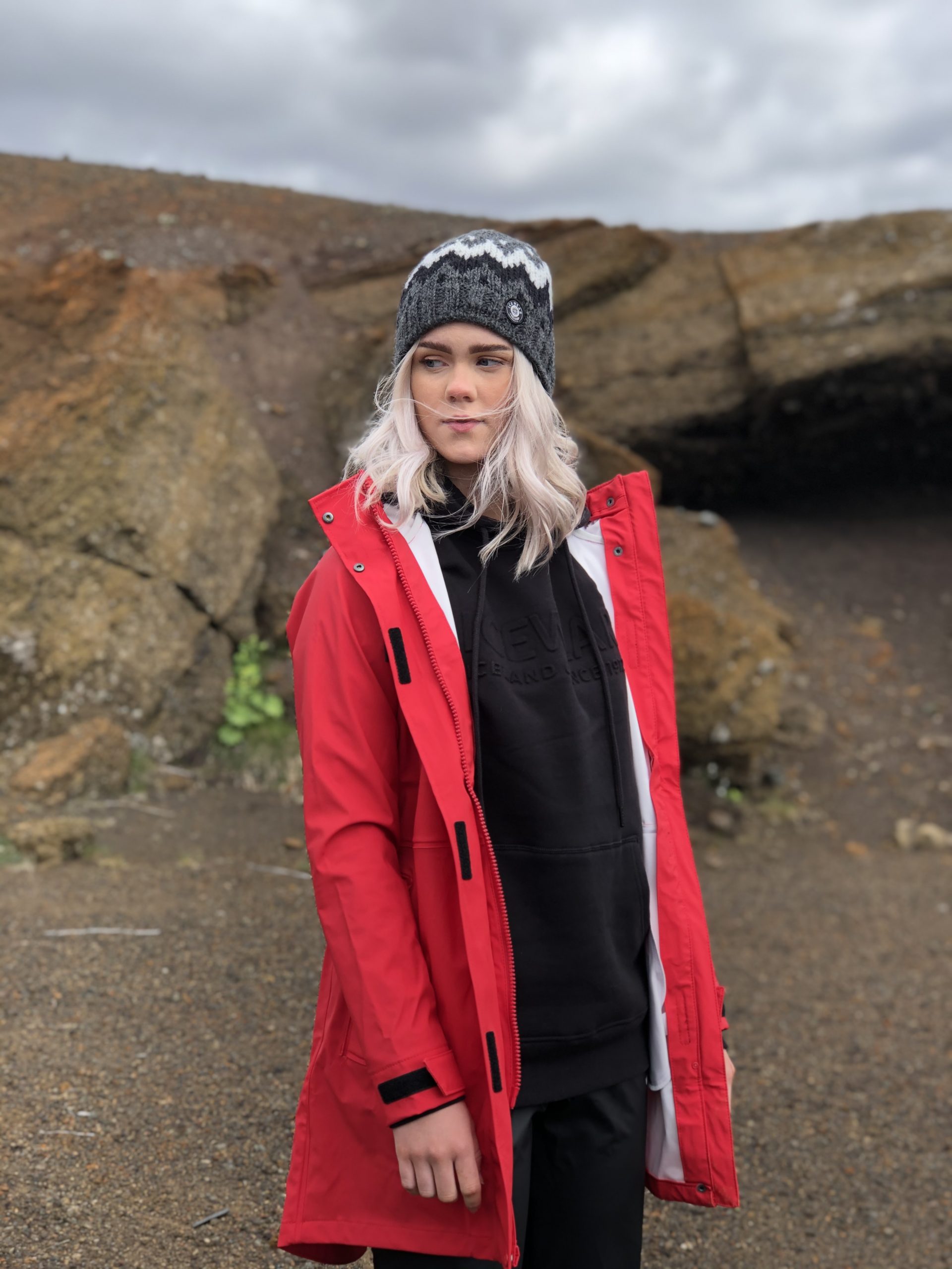 woman in red raincoat